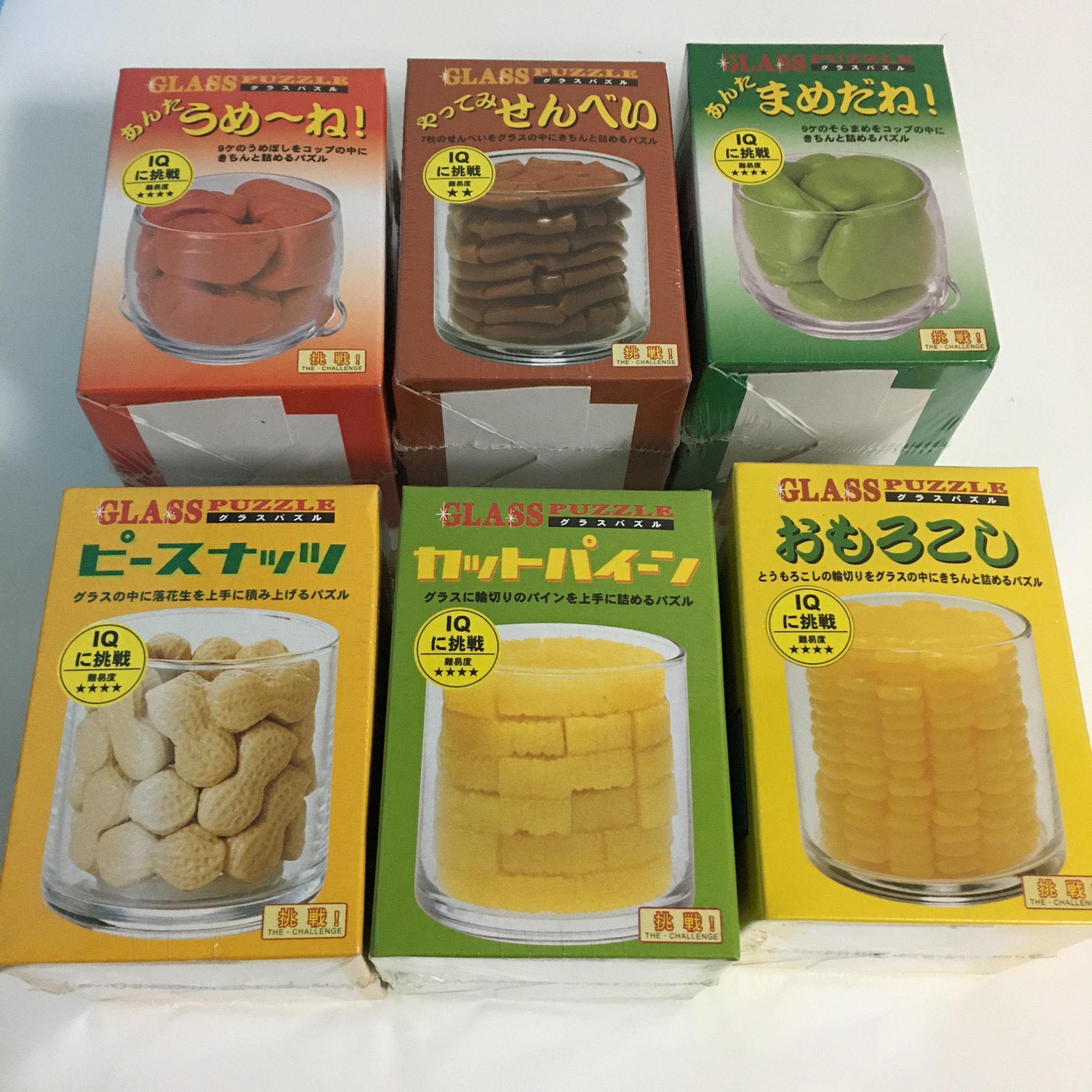 6 Glass Food Packing Puzzles made by Beverly.