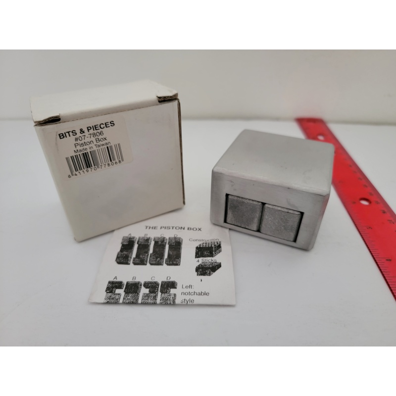 Piston Box by Marcel Gillen with solution and original box.