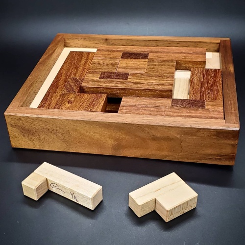 Hidden Pentominos by Tamás Vanyó and Eric Fuller
