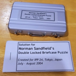 “Double Locked Briefcase Puzzle” by Norman Sandfield for the International Puzzle Party 24 held in Tokyo, Japan 2004