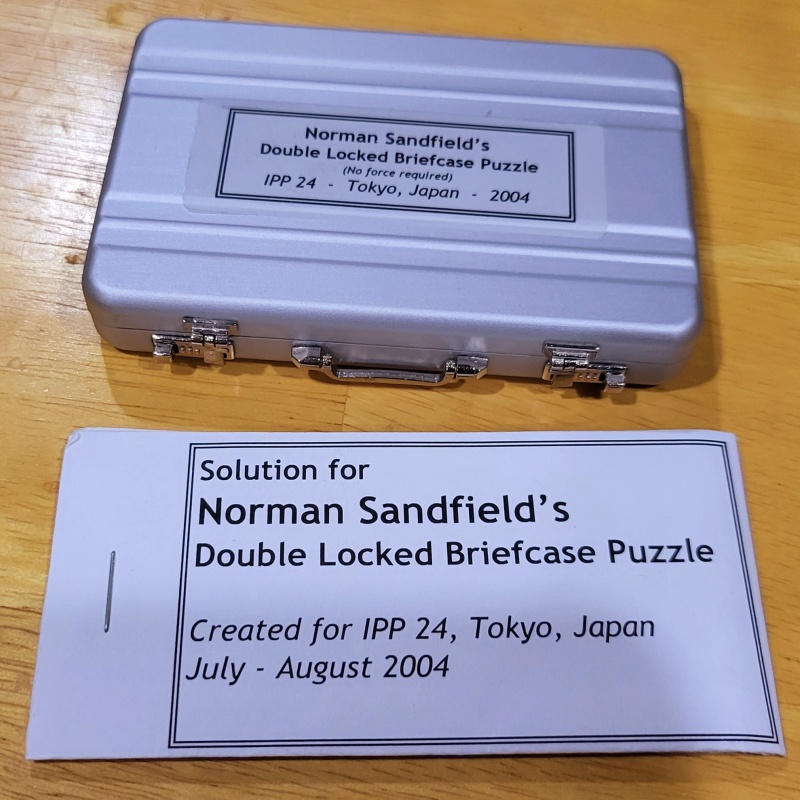 “Double Locked Briefcase Puzzle” by Norman Sandfield for the International Puzzle Party 24 held in Tokyo, Japan 2004