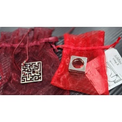 Silver puzzle ring and maze necklace by Yael Friedman