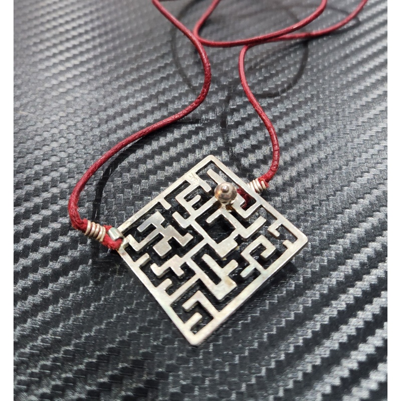 Silver puzzle ring and maze necklace by Yael Friedman