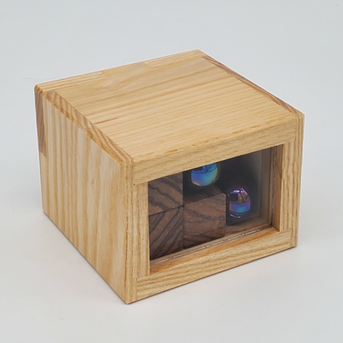 Box with Two Balls by Christoph Lohe and Eric Fuller