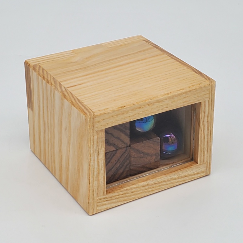 Box with Two Balls by Christoph Lohe and Eric Fuller