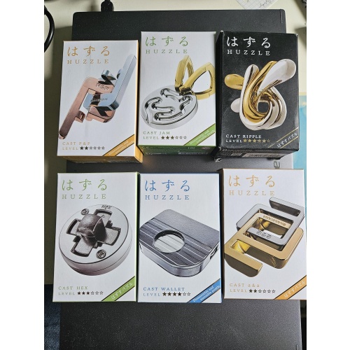 Assortment of Hanayama Puzzles from various designers