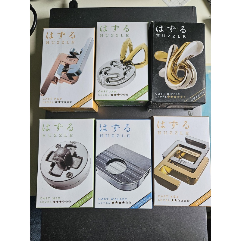 Assortment of Hanayama Puzzles from various designers