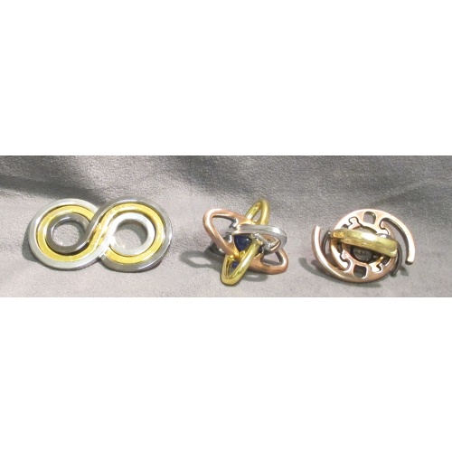 Set of 3 Doug Engel puzzles in metal
