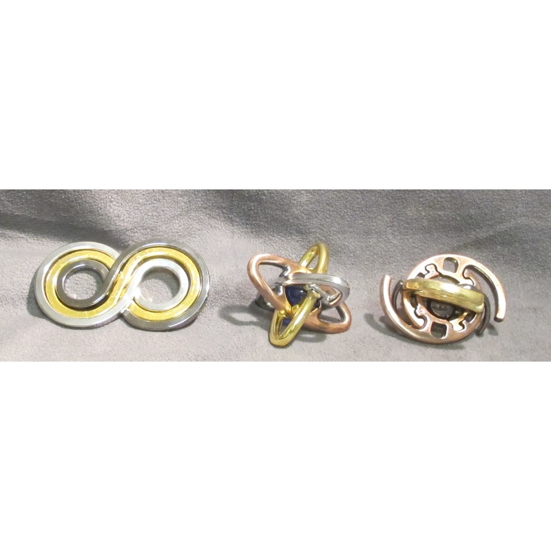 Set of 3 Doug Engel puzzles in metal