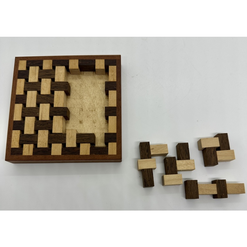Wooden interwoven puzzle by Wim Zuraan
